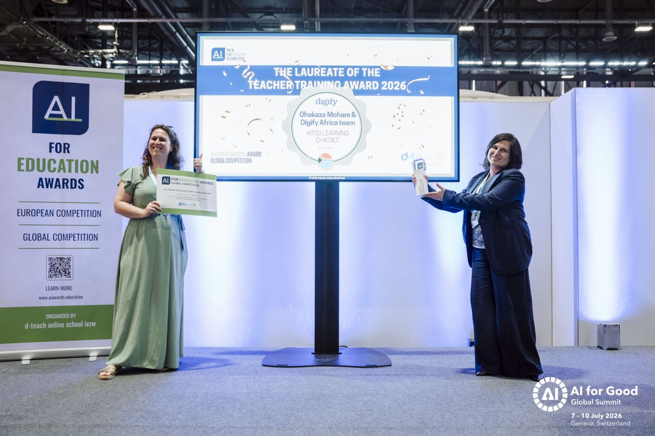 Two participants presenting a certificate and trophy for the Teacher Training Award, Geneva 2026